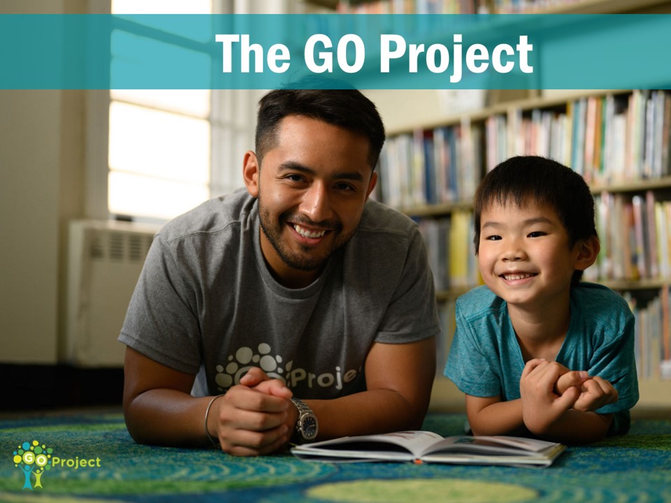 The GO Project text above two figures: one young man next to a young boy, both smiling